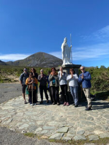 People peacefully celebrating their 2024 Croagh Patrick Climb